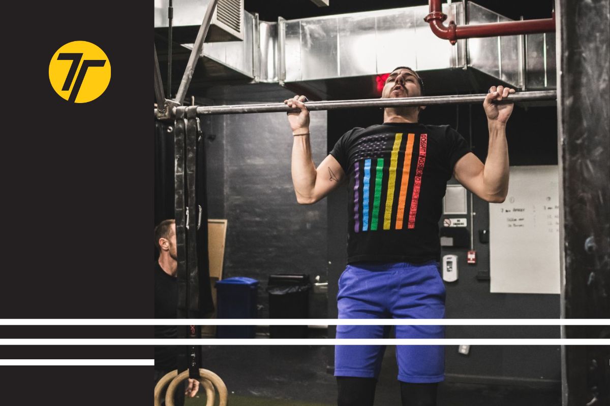 Man does pull ups wearing pride tshirt