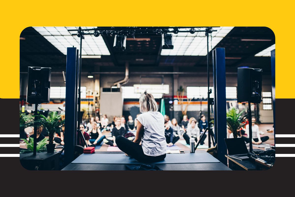 woman leads yoga at wellness event